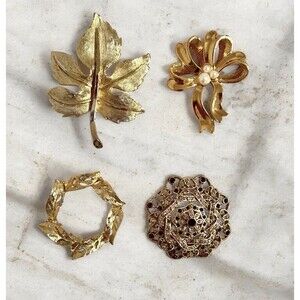 Lot 4 gold tone pins textured, leaves, circle, bow by Avon, filigree vtg